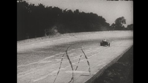 1920s Indianapolis Motor Speedway. Race Cars speed around the track and crash during the Indianapolis 500 race