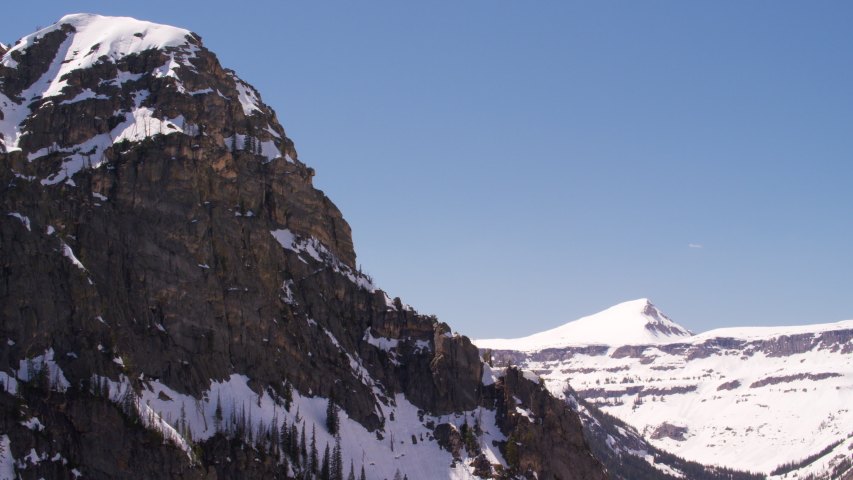 Grand Teton National Park, Rocky Mountains, Wyoming. Aerial view of beautiful snow covered mountain peaks. Shot from helicopter with Shotover gimbal and RED 8K camera.