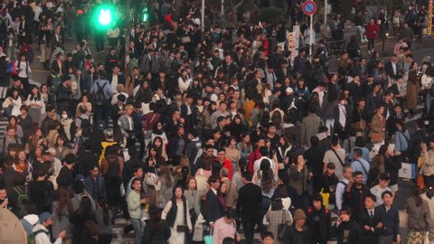 Tokyo, Japan circa-2018. Crowds of people walking across street at Shibuya Crossing in Tokyo, Japan.