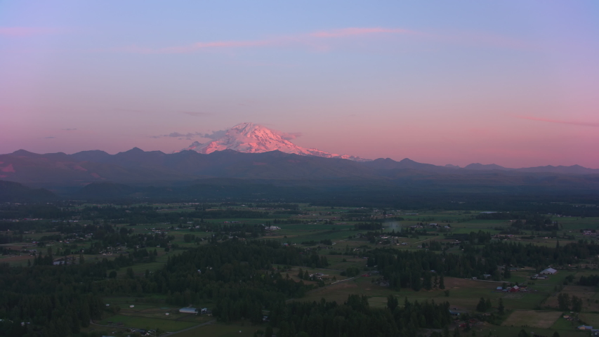 Mount Rainier, Washington circa-2019. Aerial view of Mount Rainier at sunset. Shot from helicopter with Cineflex gimbal and RED 8K camera.