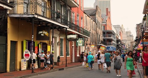 New Orleans, Louisiana - June 16, 2019: Crowds of people party and walk along the French Quarter bars and restaurants on Bourbon Street New Orleans Louisiana USA