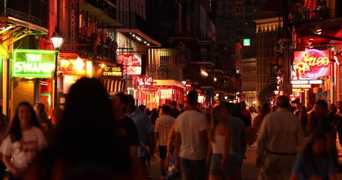 New Orleans, Louisiana - June 16, 2019: Crowds of people party and walk along the French Quarter bars and restaurants on Bourbon Street New Orleans Louisiana USA