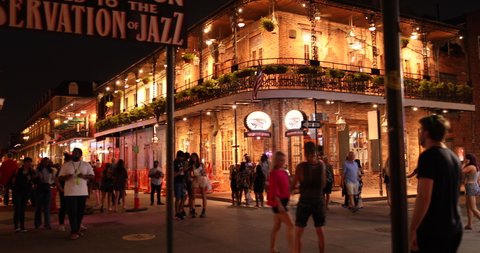 New Orleans, Louisiana - June 16, 2019: Crowds of people party and walk by the famous Preservation Hall Jazz Bar in the French Quarter bars and restaurants on Bourbon Street New Orleans Louisiana