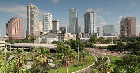 Tampa, Florida - June 14, 2019: 
 Downtown city skyline view of Tampa Florida USA looking over the freeway and the Riverwalk
