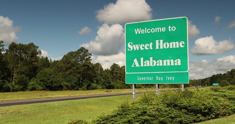 Baldwin, Alabama - June 16, 2019: Sweet Home Alabama highway welcome sign at the state border of Florida and Alabama USA