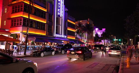 Miami, Florida - June 12, 2019: Cars and tourists along Ocean Drive in the Art Deco District of South Beach Miami Florida