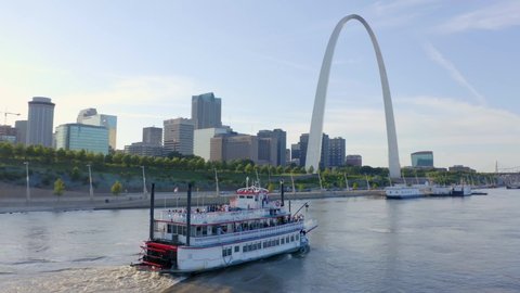 St. Louis, Missouri / USA - August 10, 2019: St. Louis Riverboat Passing Gateway Arch, Aerial Drone 4K