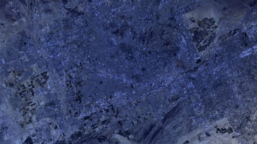 Urban landscape night to day sunrise city of Phoenix Arizona aerial satellite view animation. Contains public domain image by Nasa