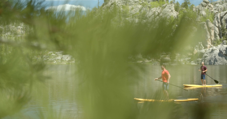 Two Men Paddleboarding at Custer State Park, South Dakota