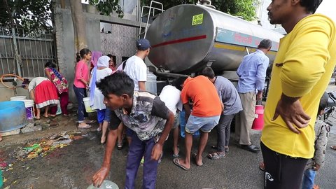 New Delhi , Delhi / India - 09 17 2019: Residents of Chilla Village filling drinking water supplied by Municipal Corporation during the water crisis at Mayur Vihar Phase 1 in New Delhi, India.