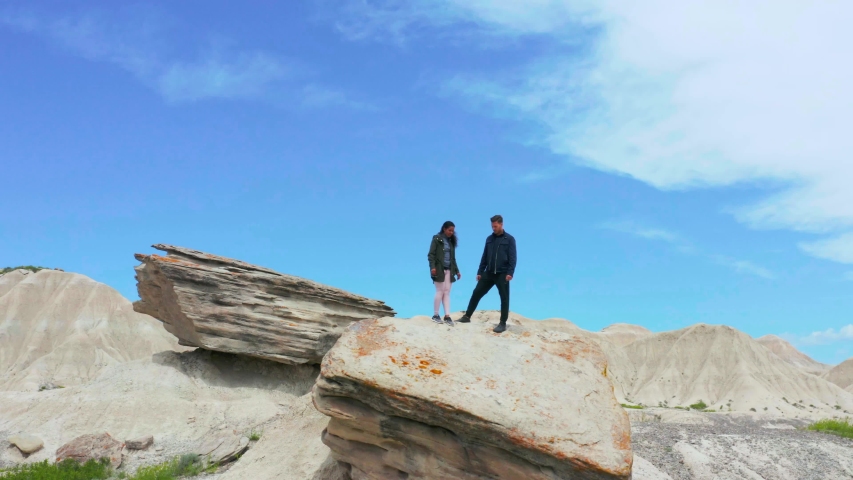 Couple Climbing Rocks at Toadstool State Park, Aerial Drone 4K