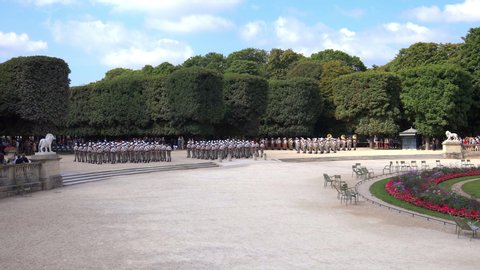 Paris, France - July 2019 : Concert and military parade of the Foreign Legion with all soldiers playing instruments or carrying weapons at attention during Bastille Day