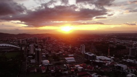 Beautiful cinematic aerial view of the sunset in the city of San Jose Costa Rica