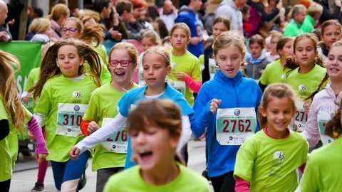 ljubljana / Slovenia - 10 28 2017: children running in slovenska cesta in ljubljana in autumn