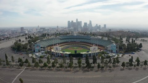 Los Angeles / United States - 09 21 2019: Dodger Stadium, home of Los Angeles Dodgers, with city background, aerial view