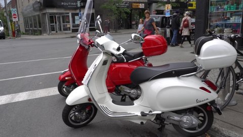Montreal , Quebec / Canada - 09 14 2019: Montreal, Canada - September 14, 2019: Two Vespa nearby of Mont-Royal street