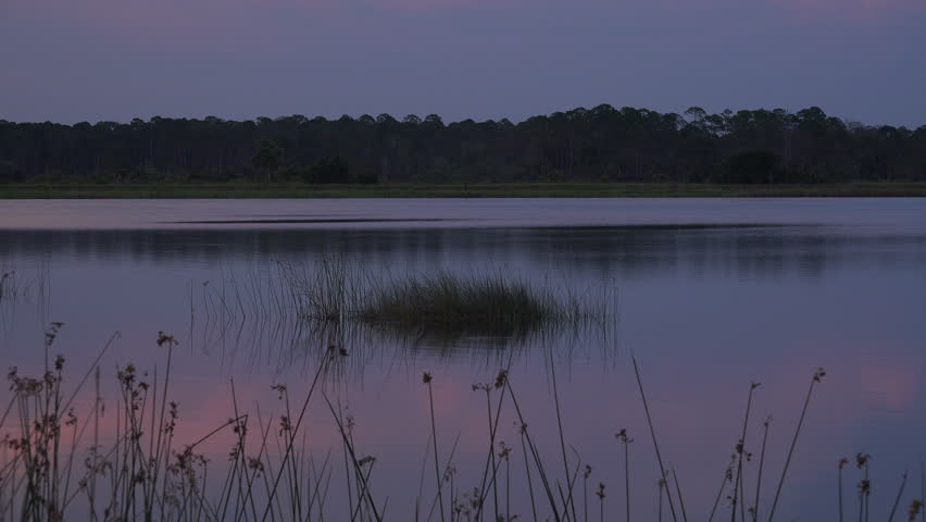 The sun falls on a Florida waterway in St. Marks National Wildlife Refuge, Florida.