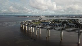 4K aerial early morning sunrise drone video of beautiful Gulf of Finland bay view of ZSD highway high-columns overpass bridge, St.Petersburg commercial port area in Russia's northern capital
