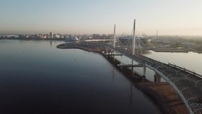 4K aerial early morning sunrise drone video of beautiful Gulf of Finland bay view of ZSD highway cable-stayed bridges, St.Petersburg commercial port area in Saint-Petersburg, Russia's northern capital