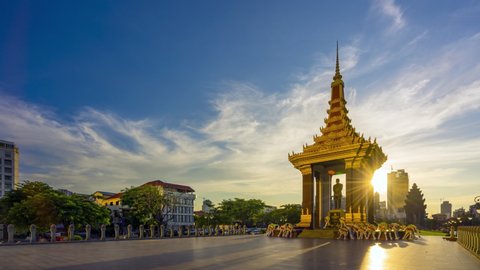 PHNOM PENH, CAMBODIA - October 16,2019 : Time lapse of a Statue of King Father Norodom Sihanouk with blue and yellow sky in evening sunset background at central Phnom Penh, Capital of Cambodia.