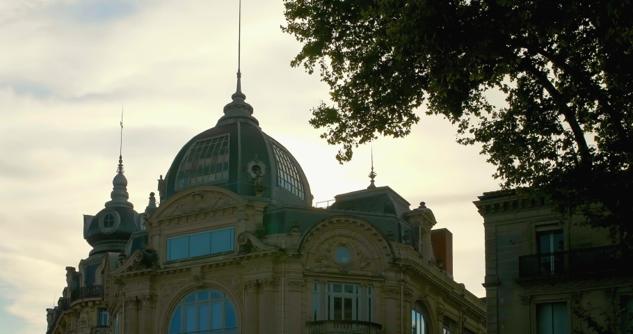 Facade of La Opera de la Comedie in Montpellier, France during the afternoon on a cloudy day.