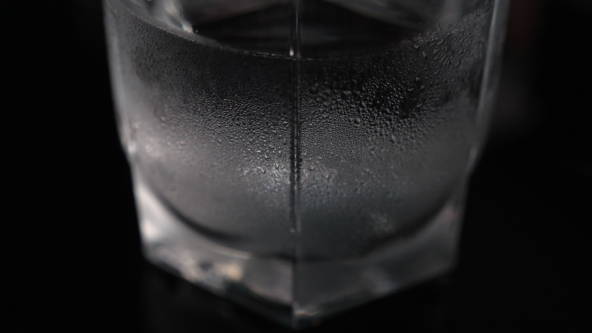 Close-up of Water droplets on glass, cool steam on the surface close up view. | Shutterstock HD Video #1039219541