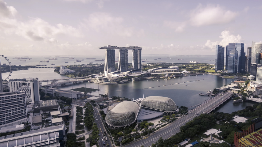 Marina Bay, Singapore - July 6, 2019: 4k time lapse of cloudscape scene during bright day light at Singapore city. Zoom out Royalty-Free Stock Footage #1039223054