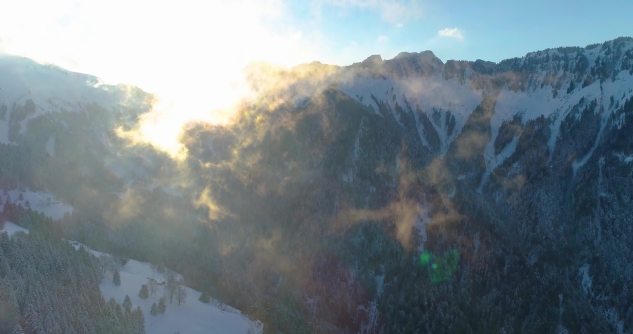 4k drone shot over snow forest in swiss montain near montreux