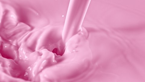 Super Slow Motion Shot of Pouring and Splashing Strawberry Milk at 1000fps.