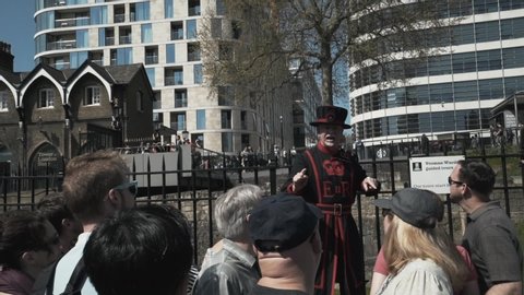 London / United Kingdom (UK) - 04 22 2018: Beefeater giving free tour to the tourists at the Tower of London during the day