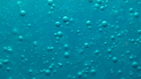 Abstract blue bubbles background. Macro liquid dish soap.