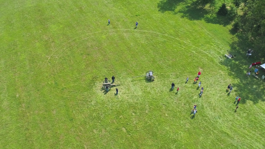 An Aerial View of a Civil War Cannon being fired at a Civil War re-enactment