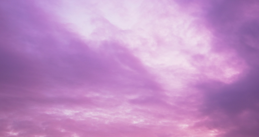 Beautiful dramatic nature clouds in red, orange, purple sunrise. Meteorology cloudscape environment. Dynamic close up shot filmed in 4k UHD