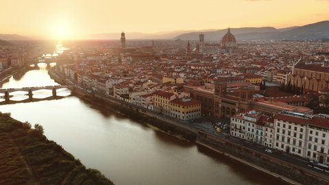 Aerial Drone View: Historically and Culturally Rich Italian Town on the Sunny Day. Beautiful Old City With Medieval Churches and Cathedrals. River Runs through the City