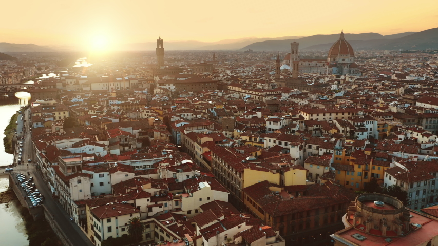 Aerial Drone View: Historically and Culturally Rich Italian Town on the Sunny Day. Beautiful Old City With Medieval Churches and Cathedrals. River Runs through the City Royalty-Free Stock Footage #1039245227