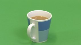 Green screen shot of a white male hand taking a cup of tea - Powered by Shutterstock - Get 15% off with code: PIKWIZARD15