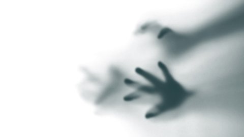Abstract and spooky defocused hand in slow motion
