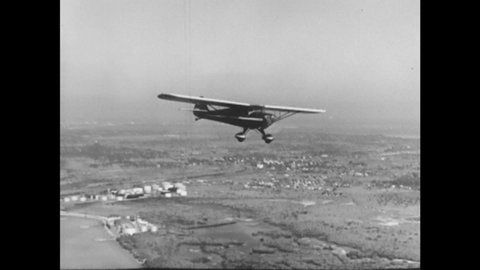 1940s: Cessna airplane rolls and struggles to maintain steady flight.