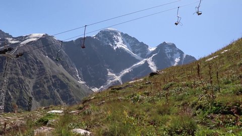 Working ski lift without people on Cheget Caucasus mountains in summer