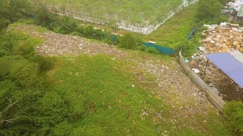 Aerial shot of hidden plastics dumping,Johor,Malaysia