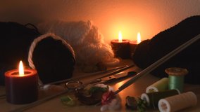 Cozy background of a knitting table with candles and knitting equipment - Powered by Shutterstock - Get 15% off with code: PIKWIZARD15