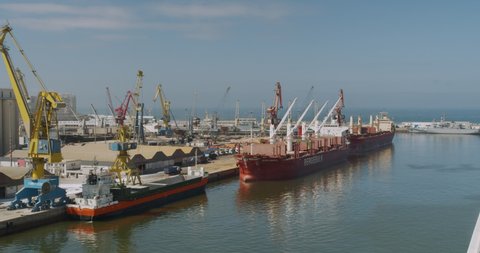 CASABLANCA, MOROCCO - October 15, 2019: Loading a cargo ship at the seaport. Port with large ships and cranes.