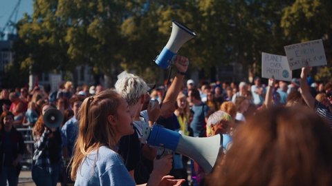 London / United Kingdom (UK) - 09 20 2019: Young girl shouts through a megaphone at a protest