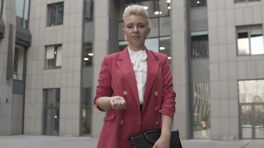 Crypto currency in the form of Bitcoin in the hands of a business woman. Buying or selling cryptocurrency in bitcoin video.