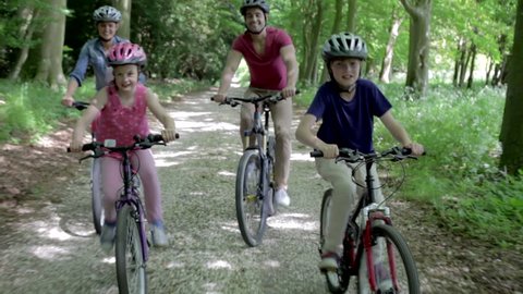Camera tracks family as they cycle along track.Shot on Canon 5d Mk2 with a frame rate of 30fps