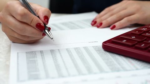 businesswoman audit financial reports, extra close up