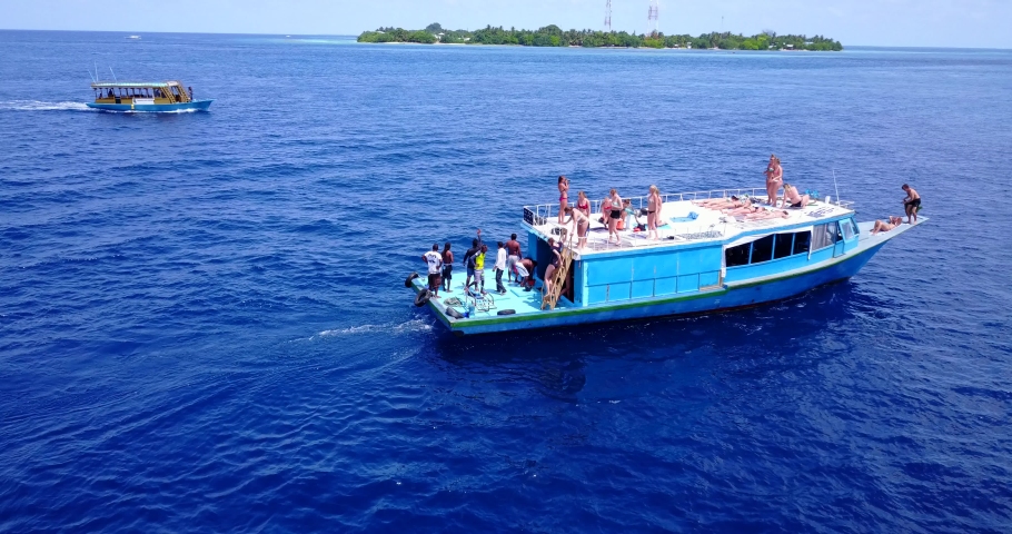 Boat party off the coast of remote island in Hawaii, Waikiki