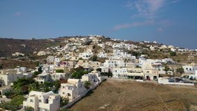 Aerial drone video of iconic small traditional village of Akrotiri near famous archaeological site, Santorini island, Cyclades, Greece