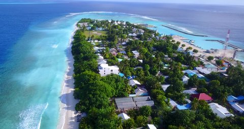 Aerial view of luxury resort villas on the tropical island coastline, Maldives