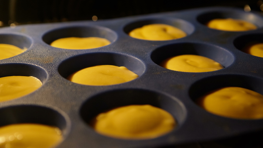 Muffins. Baking in oven. Time lapse footage of cooking Cupcakes, 4k, UHD Royalty-Free Stock Footage #1039344212